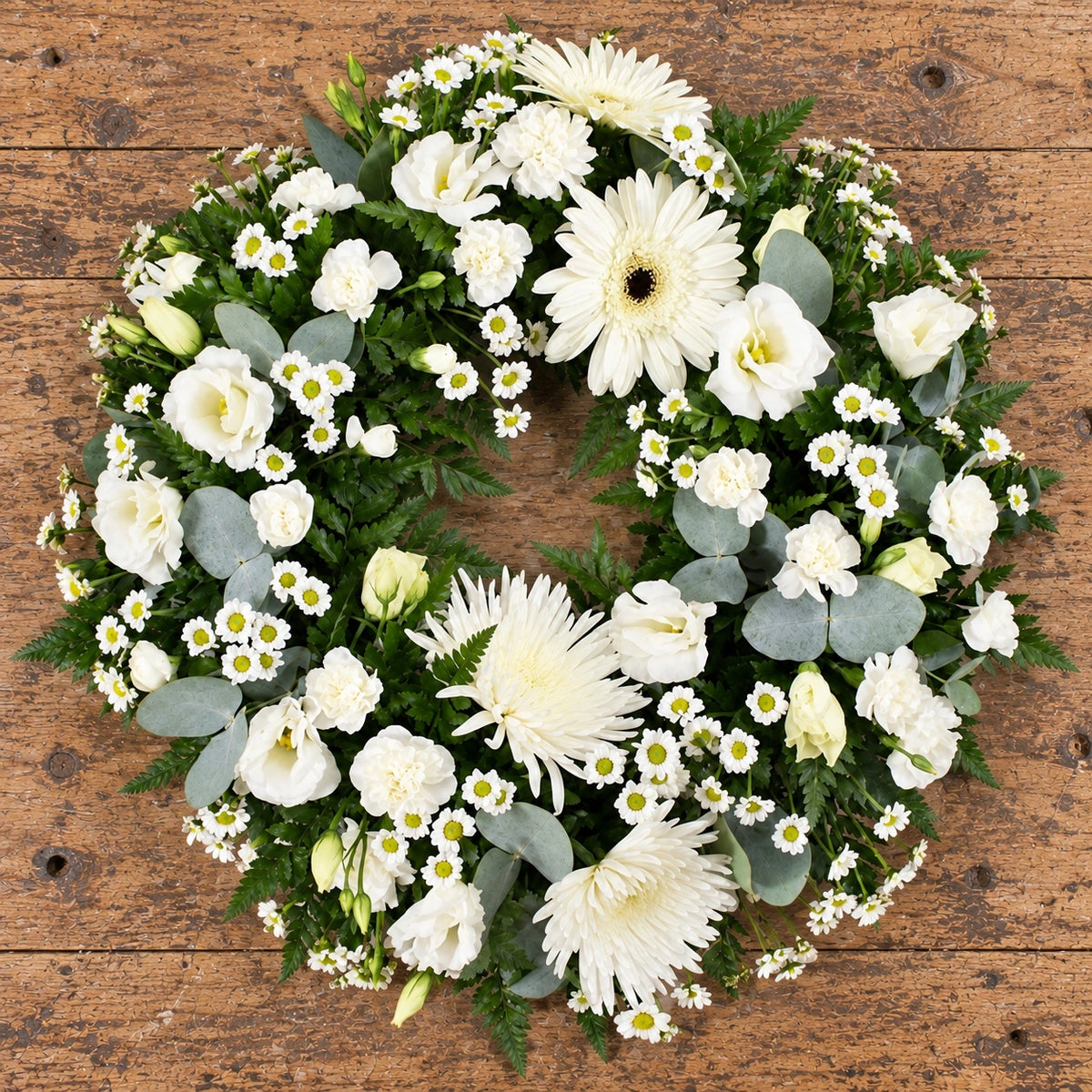 Cream & White Wreath — overhead workbench view