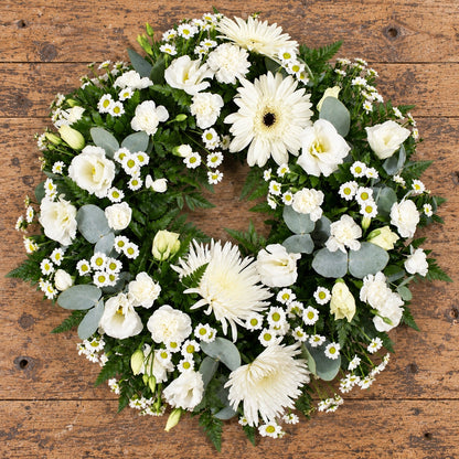 Cream & White Wreath — overhead workbench view
