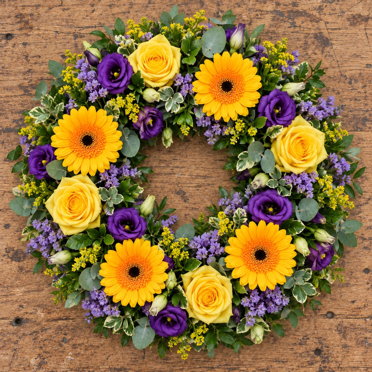 Florist's Choice Wreath — overhead workbench view