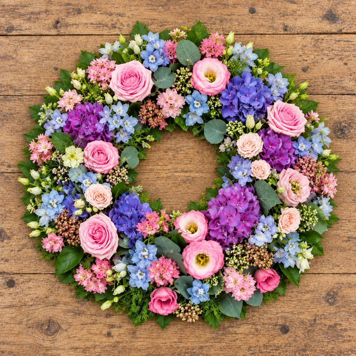 Summer Wreath — overhead workbench view