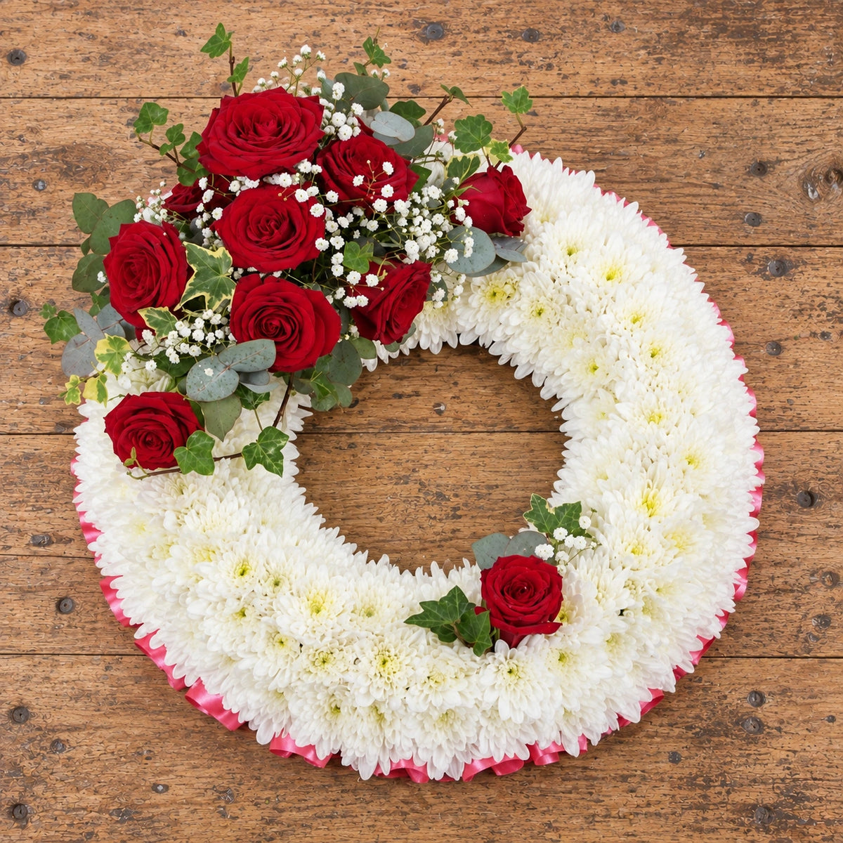 Traditional Massed Wreath — overhead workbench view