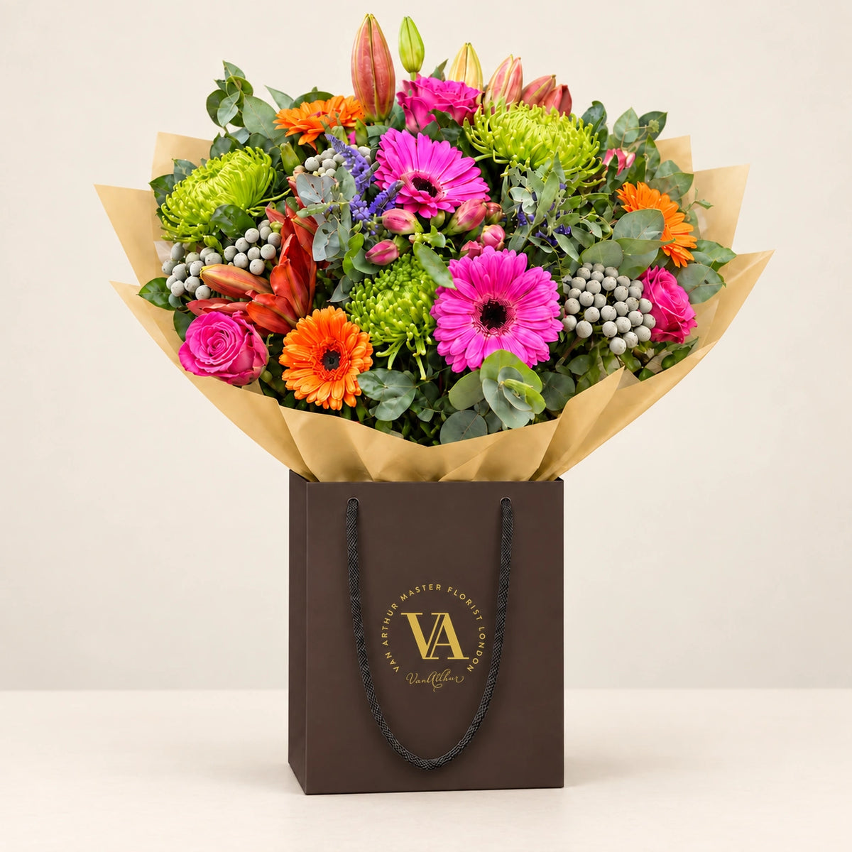 Carnival by Van Arthur Master Florist — the bouquet in signature packaging against a quiet backdrop.
