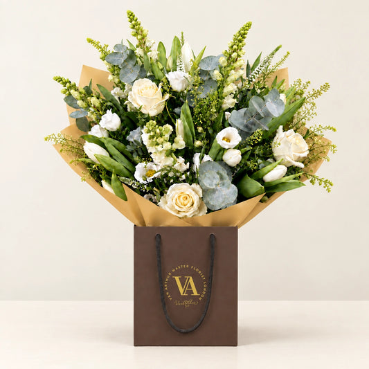Classic Virginia by Van Arthur Master Florist — the bouquet in signature packaging against a quiet backdrop.