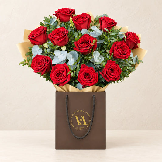 Scarlett by Van Arthur Master Florist — the bouquet in signature packaging against a quiet backdrop.