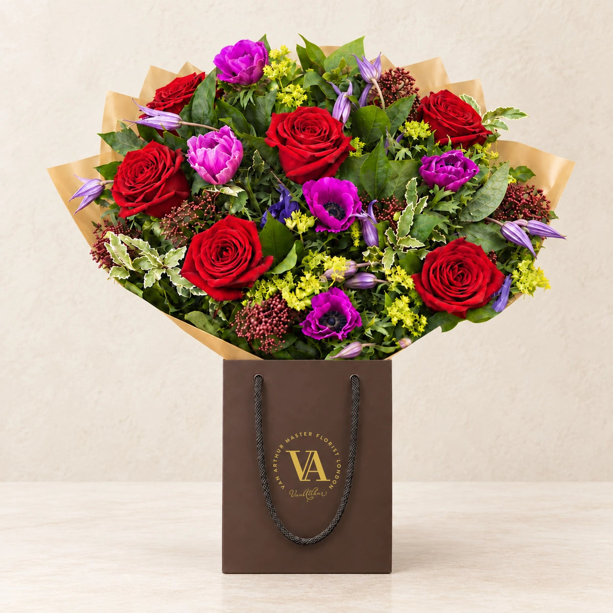 Straight from the Heart by Van Arthur Master Florist — the bouquet in signature packaging against a quiet backdrop.