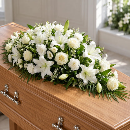 White Casket Spray — on a coffin